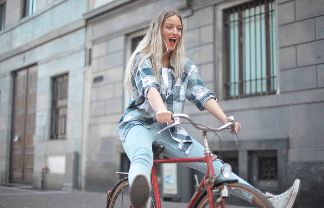Woman riding a bike without pedaling