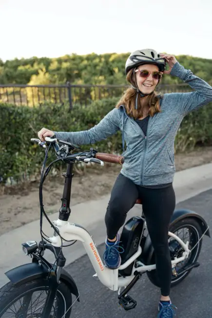 Woman riding step-thru e-bike model