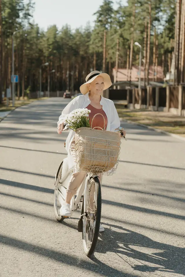 Senior woman getting exercise riding e-bike 