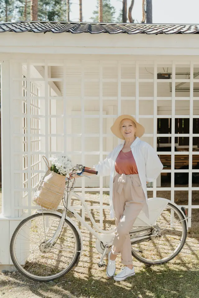 Senior citizens women whose happy to ride her e-bike.