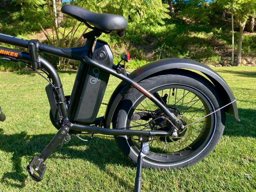 Black electric bike with battery in the middle under the seat.