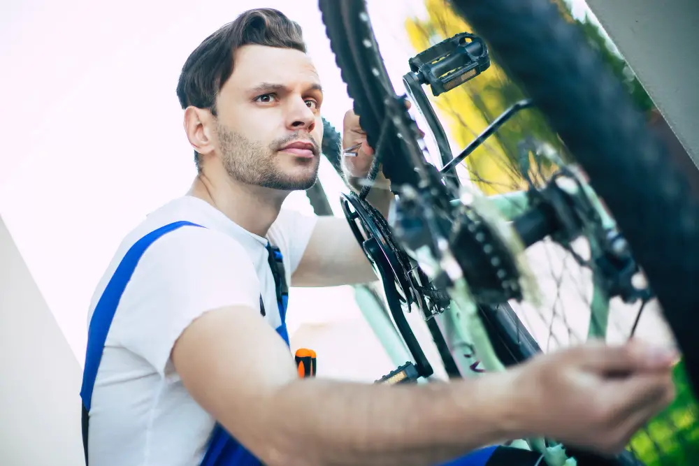 Man lifting heavy electric bike