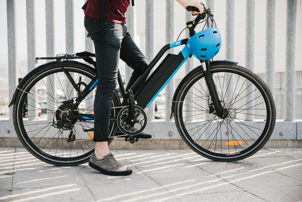 woman on electric bike with battery