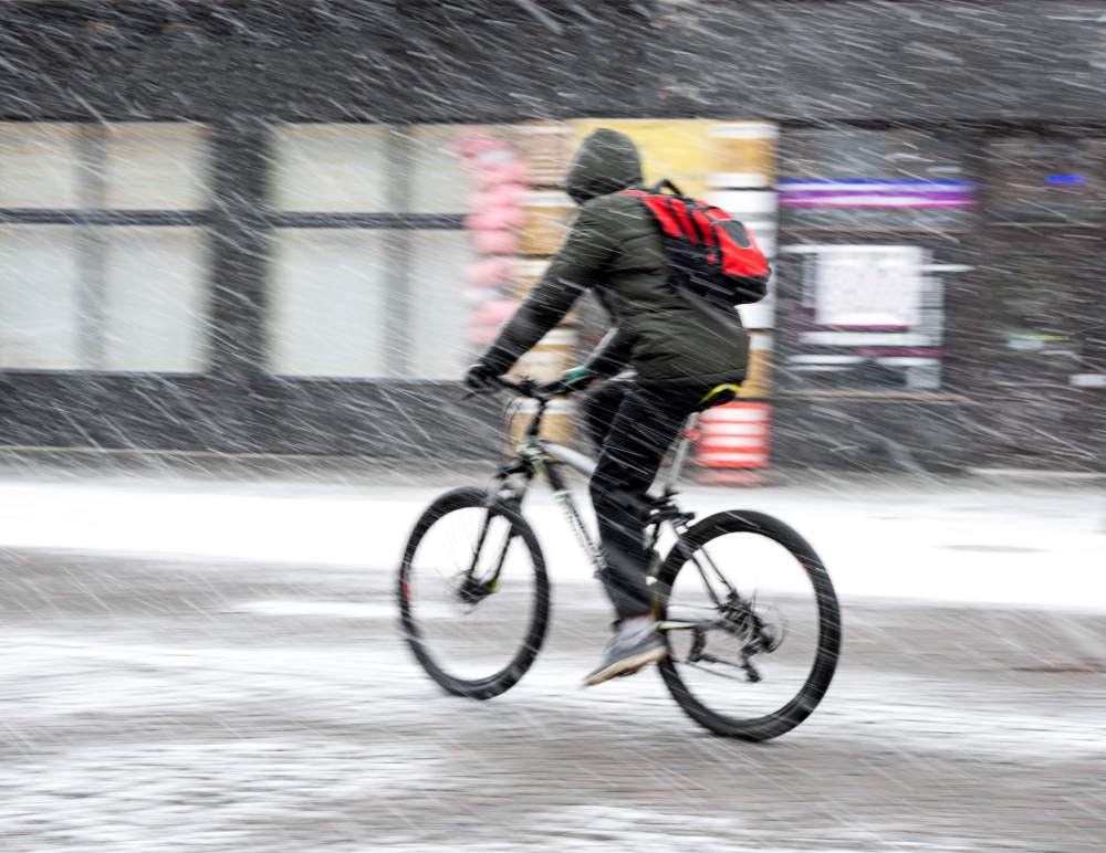 Man on bicycle in the snow