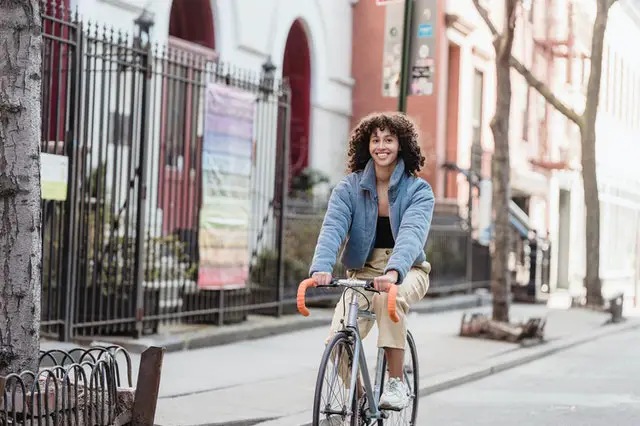 Woman riding a regular bike