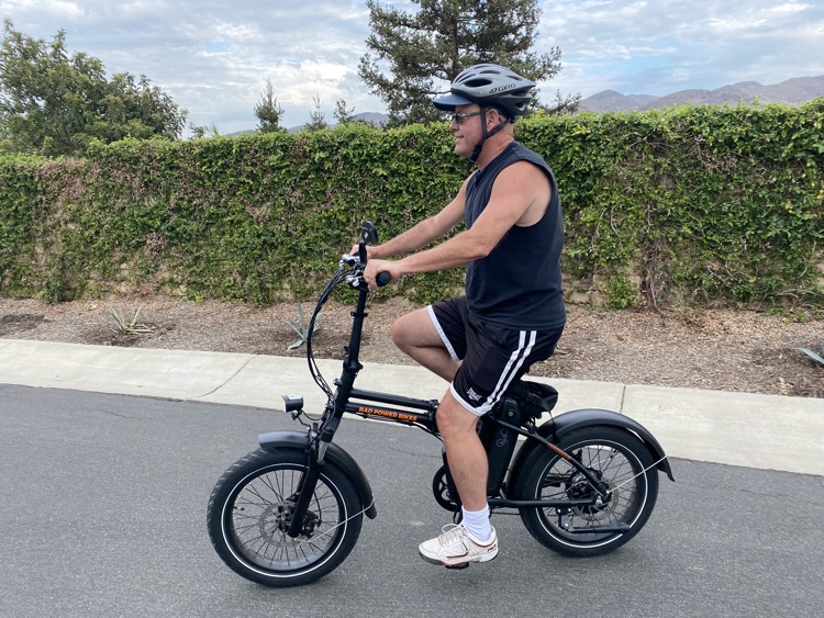 Man riding e-bike with 20" X 3" wide tires