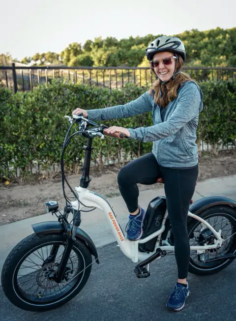 Woman on RadMini Step-Thru Folding E-Bike