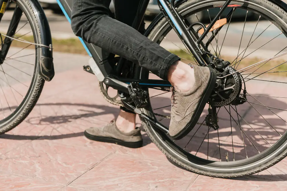 pedaling an e-bike showing foot only