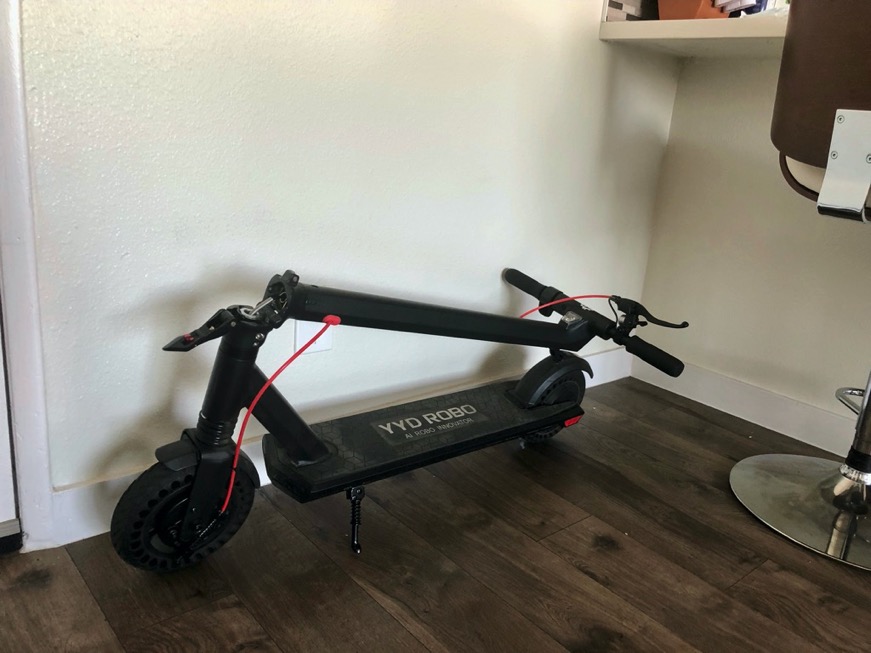 Folding Electric Scooter in Corner