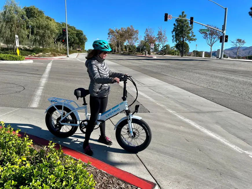 Woman riding white electric bike