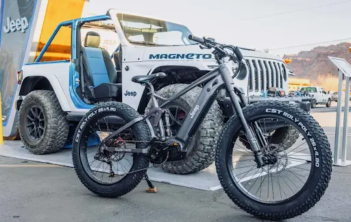 QuietKat- eep E-bike in front of a Jeep auto