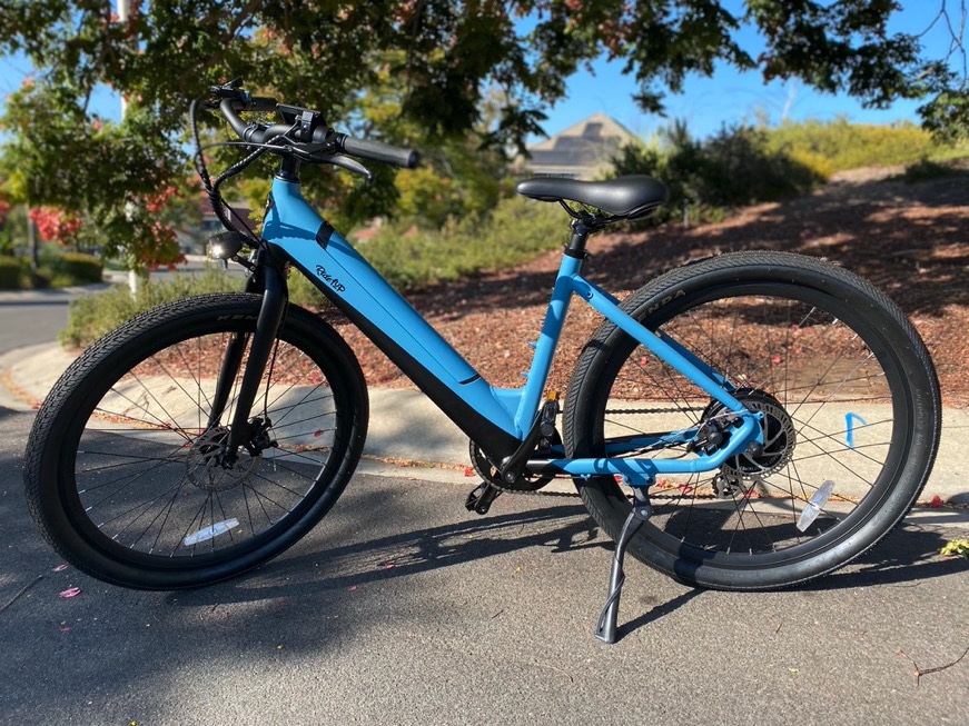Blue Ride1Up Core-5 E-Bike with tree in the background