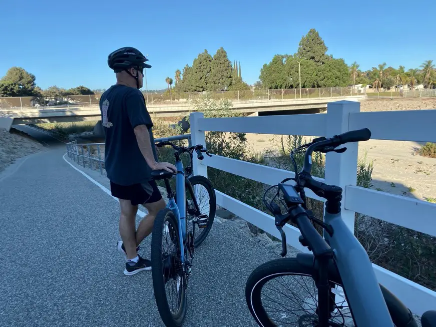 Man standing next to Step Through E-Bike