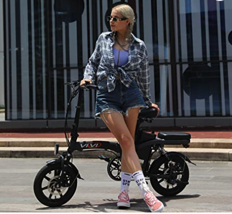 woman standing in front of Vivi Folding Electric Bike