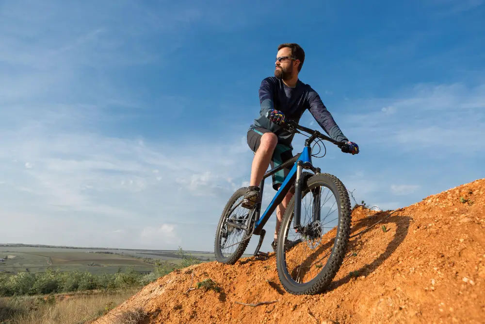 Man riding mountain bike on a hill