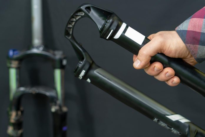 hand holding Front Suspension Fork