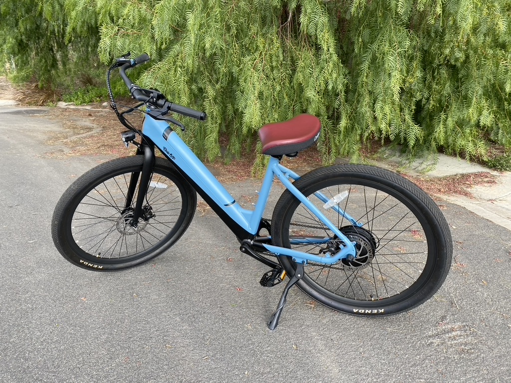 Blue electric bike with burgundy saddle