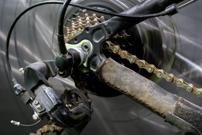 Electric bike chain and derailleur that needs cleaning.