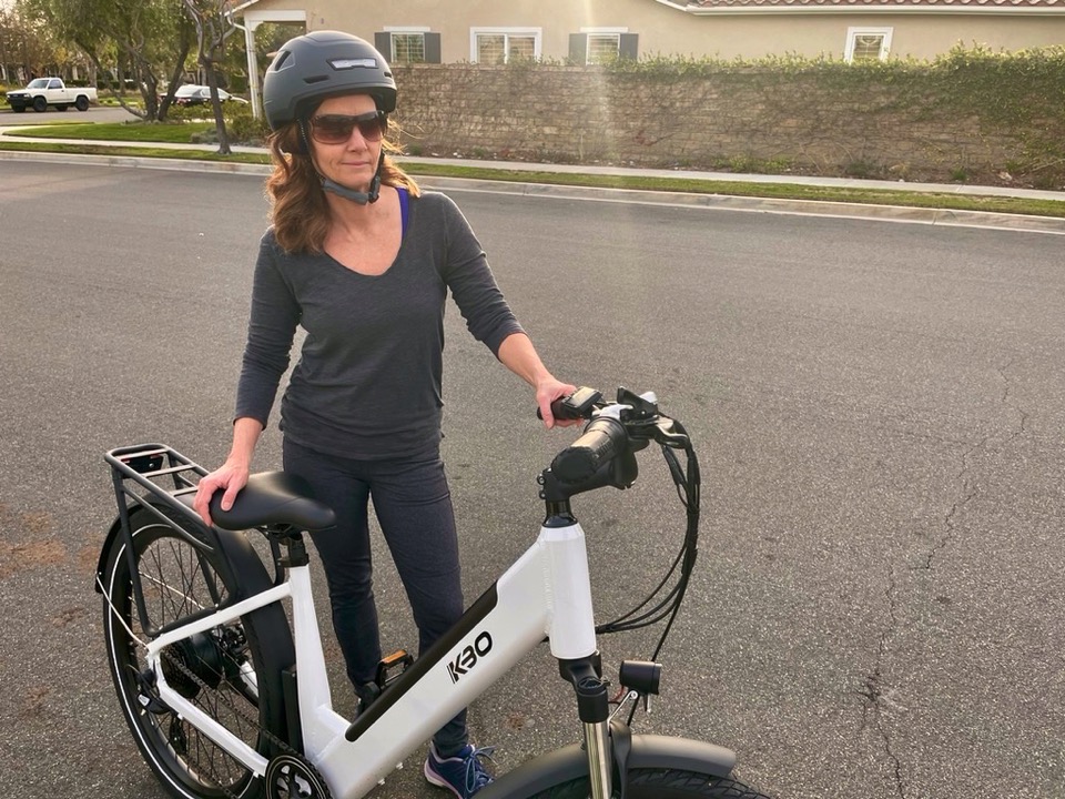 Woman standing next to the Breeze e-Bike
