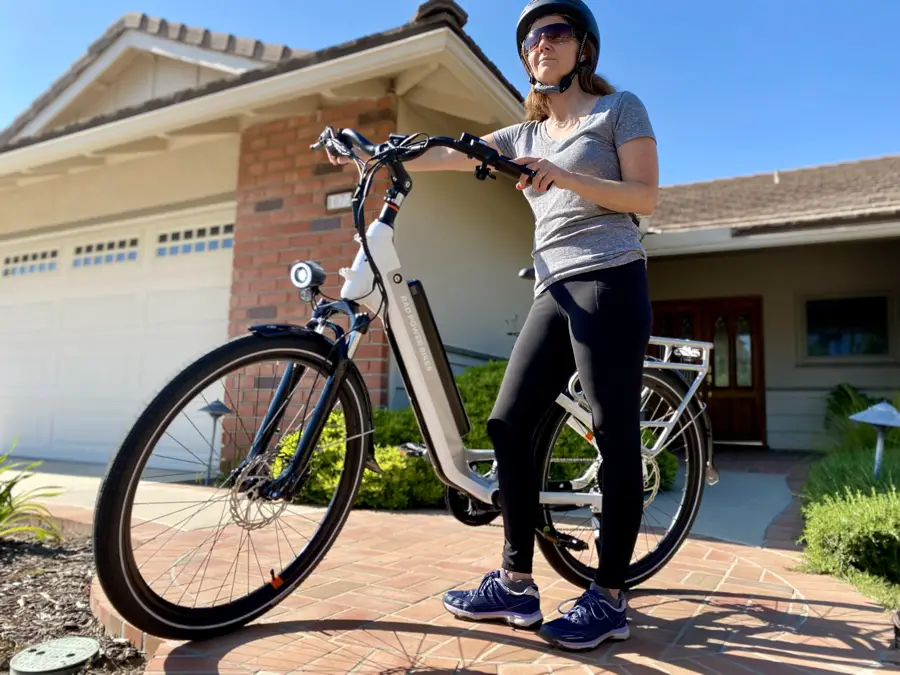 Women standing next to white RadCity 5 Plus e-bike