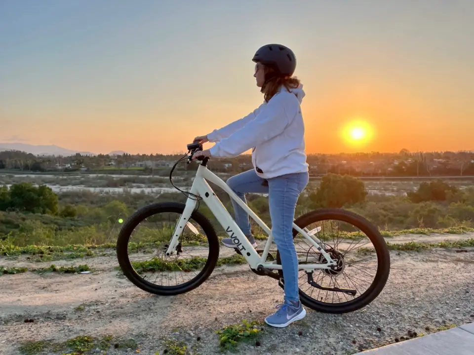 Woman Riding the Vvolt Alpha S at Sunset