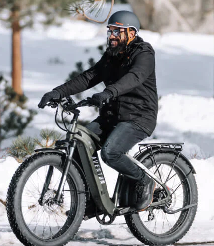 Man riding the Aventon Aventure 2 in the Snow