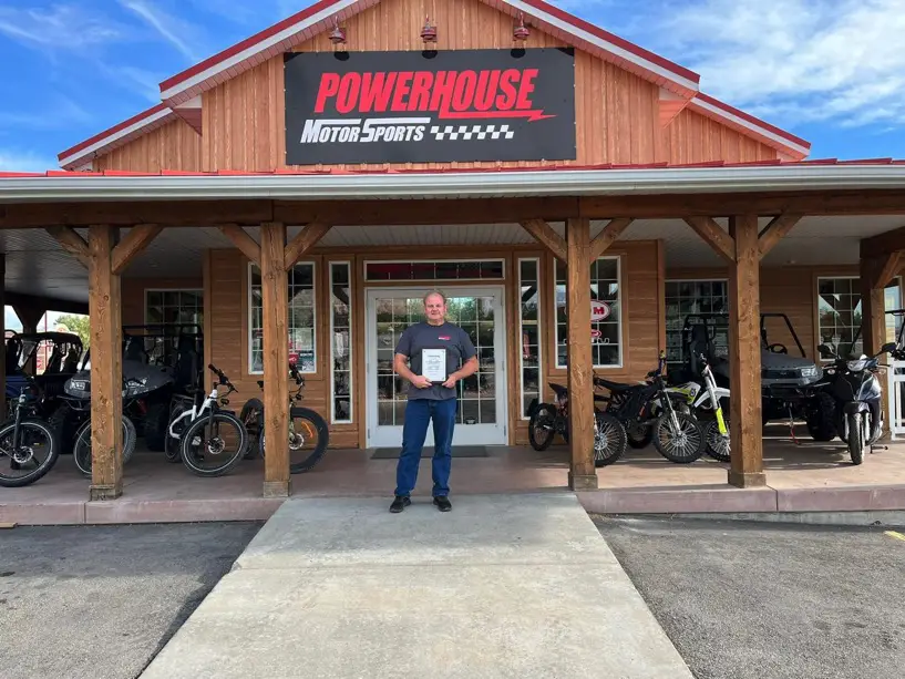 Man in front of sports store