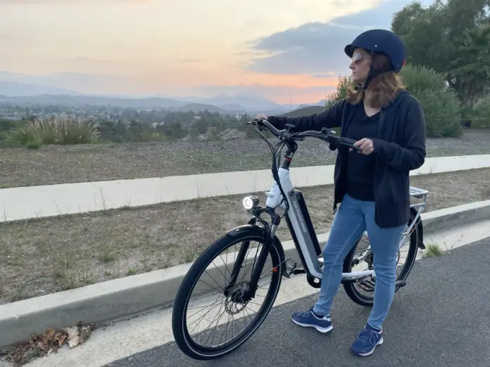 Base Camp Denim Helmet on female ebike rider
