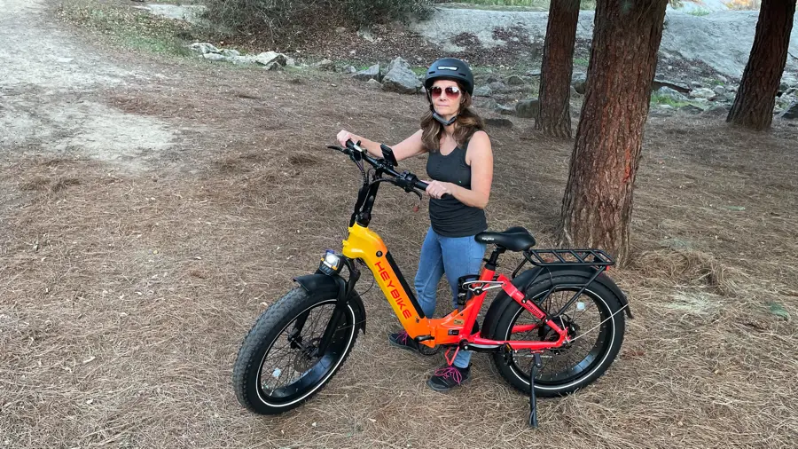 Woman standing next to Heybike Horizon