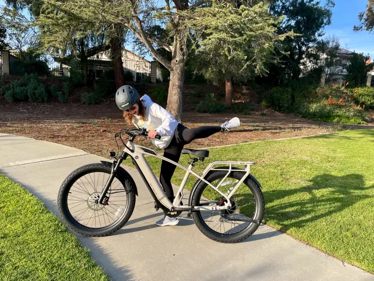 Woman throwing leg over the the Cafe Cruiser