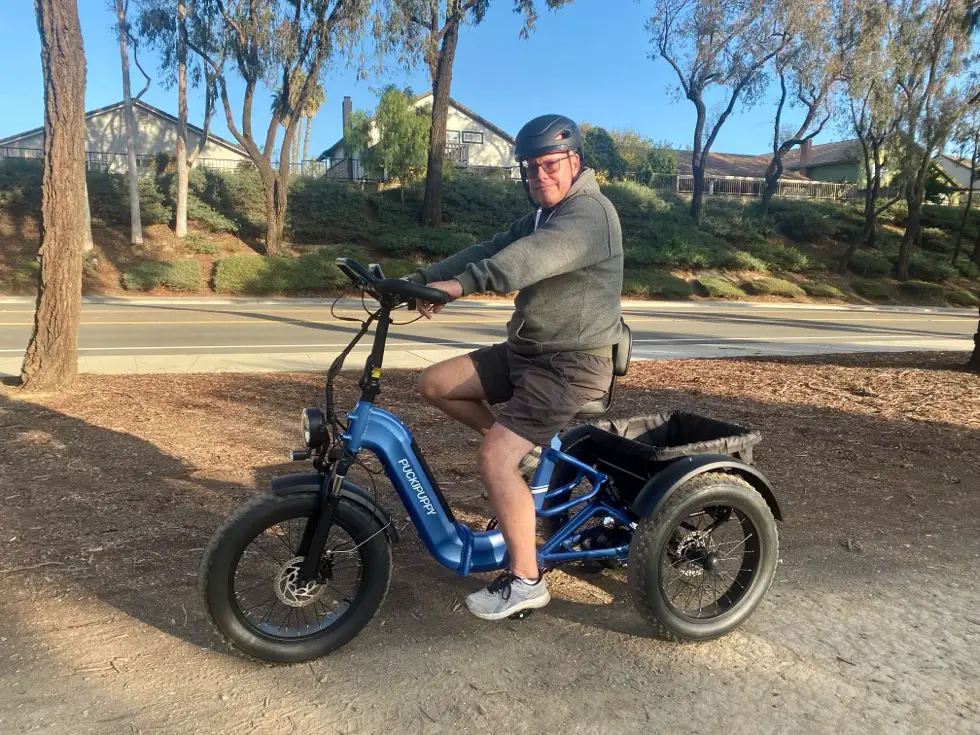 Man Riding Puckipuppy Electric Tricycle